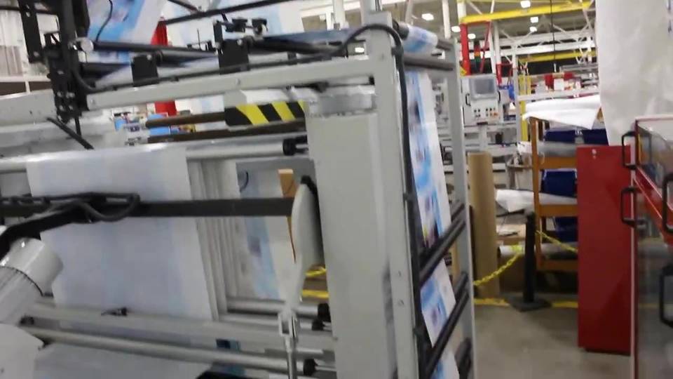 Wicketer machine stacking printed bags onto wickets